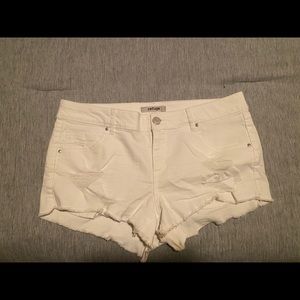 White ripped shorts